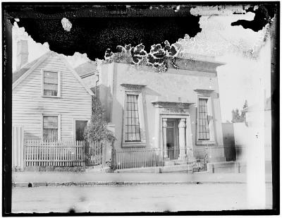 Photograph of Hobart Synagogue with a long-demolished house next door.